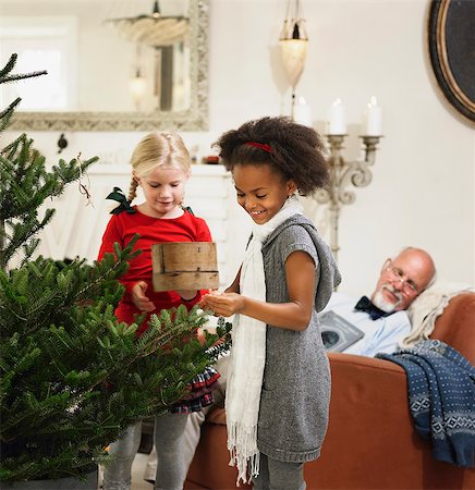 Girls decorating Christmas tree Stock Photo - Premium Royalty-Free, Code: 649-06489270