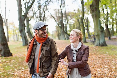 fall fun - Couple walking together in forest Stock Photo - Premium Royalty-Free, Code: 649-06489816