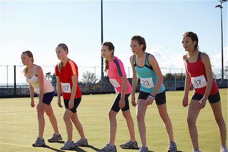 preteen sports - Runners lined up to race in field Stock Photo - Premium Royalty-Free, Code: 649-06490116