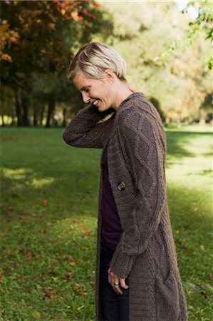 Woman walking in park Stock Photo - Premium Royalty-Free, Code: 649-06532682