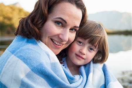 enjoy together - Mother and daughter wrapped in blanket Stock Photo - Premium Royalty-Free, Code: 649-06533032