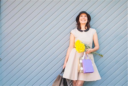 fashion women vintage - Woman holding shopping bags outdoors Stock Photo - Premium Royalty-Free, Code: 649-06533044