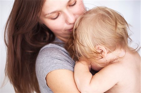fussy - Close up of mother holding daughter Stock Photo - Premium Royalty-Free, Code: 649-06533366