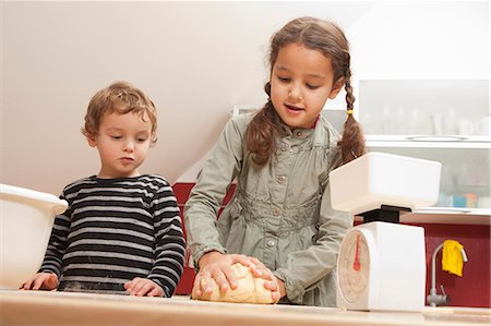 Girl kneading dough in kitchen Stock Photo - Premium Royalty-Free, Code: 649-06533523