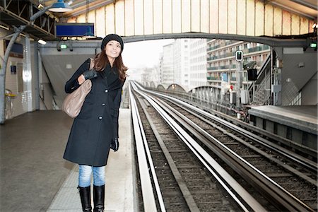 Woman waiting at train station Stock Photo - Premium Royalty-Free, Code: 649-06621986