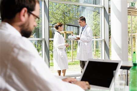 simsearch:6113-06720636,k - Doctors talking in conference room Stock Photo - Premium Royalty-Free, Code: 649-06622097