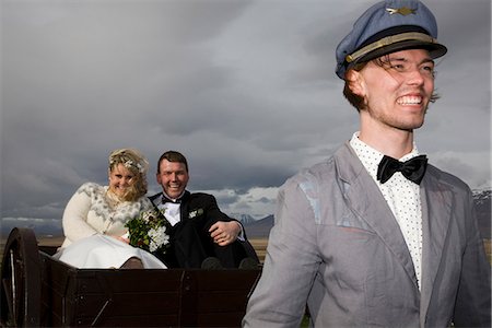 simsearch:649-06432557,k - Man driving newlyweds in wooden cart Stock Photo - Premium Royalty-Free, Code: 649-06622249