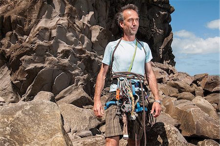 rock climber - Rock climber wearing clips and ropes Stock Photo - Premium Royalty-Free, Code: 649-06622367