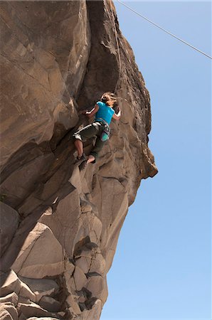 extreme sport not snow not ice not winter - Rock climber scaling jagged cliff Stock Photo - Premium Royalty-Free, Code: 649-06622374