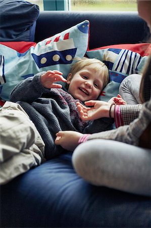 simsearch:649-06716505,k - Children playing together on sofa Stock Photo - Premium Royalty-Free, Code: 649-06622414