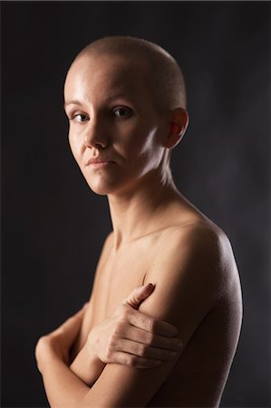 shaved head - Nude woman hugging her chest Stock Photo - Premium Royalty-Free, Code: 649-06622679