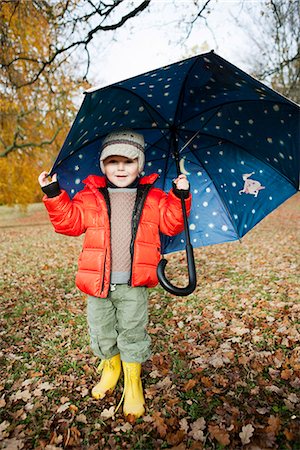 simsearch:649-06623087,k - Boy in rain boots and umbrella in park Stock Photo - Premium Royalty-Free, Code: 649-06623073