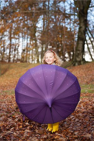 simsearch:649-06623087,k - Girl playing with umbrella in park Stock Photo - Premium Royalty-Free, Code: 649-06623088