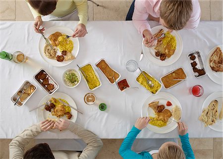 Overhead view of people at table Stock Photo - Premium Royalty-Free, Code: 649-06623162