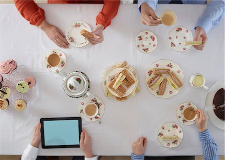 photos of hands and cups - Overhead view of people having tea Stock Photo - Premium Royalty-Free, Code: 649-06623172