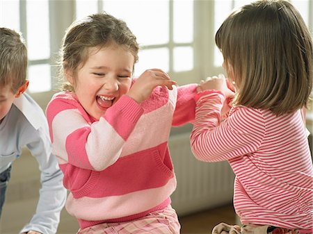 simsearch:649-06716505,k - Children playing together indoors Stock Photo - Premium Royalty-Free, Code: 649-06716534