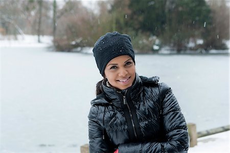 simsearch:649-06532763,k - Woman standing in snowy field Photographie de stock - Premium Libres de Droits, Code: 649-06716634