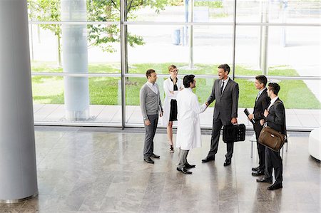 doctors with person in a suit - Business people and doctors greeting Stock Photo - Premium Royalty-Free, Code: 649-06716706