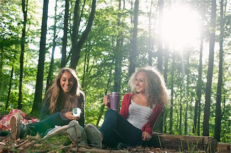Teenage girls having picnic in forest Stock Photo - Premium Royalty-Free, Code: 649-06716825