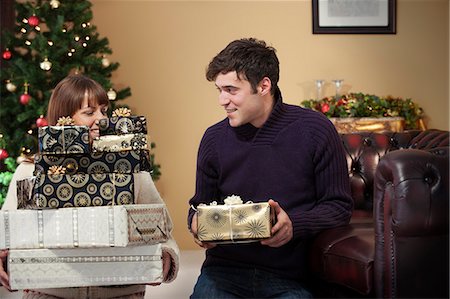 simsearch:649-06716867,k - Couple giving presents at Christmas Stock Photo - Premium Royalty-Free, Code: 649-06716872