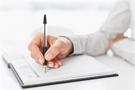 personal organizer - Businessman taking notes at desk Stock Photo - Premium Royalty-Free, Code: 649-06717068