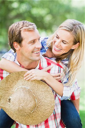 simsearch:649-03447245,k - Man carrying girlfriend in park Stock Photo - Premium Royalty-Free, Code: 649-06717252