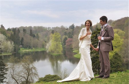 Newlywed couple toasting each other Stock Photo - Premium Royalty-Free, Code: 649-06717403