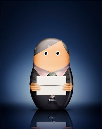 simsearch:649-06717567,k - Businessman Russian doll with envelope Stock Photo - Premium Royalty-Free, Code: 649-06717628