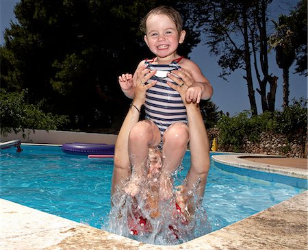 simsearch:6113-06909372,k - Mother and daughter in swimming pool Stock Photo - Premium Royalty-Free, Code: 649-06717799