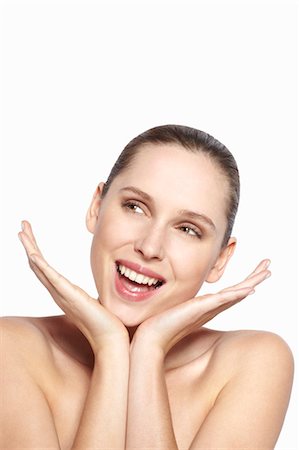 simsearch:649-06305009,k - Smiling woman resting chin in hands Stock Photo - Premium Royalty-Free, Code: 649-06717844