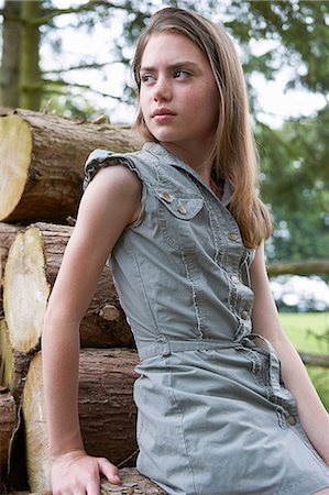 freckle - Teenage girl leaning on logs in  forest Stock Photo - Premium Royalty-Free, Code: 649-06812062