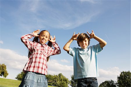 Boy and girl pulling faces Stock Photo - Premium Royalty-Free, Code: 649-06812445