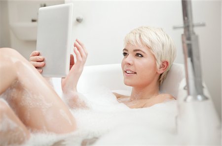 soapsuds - Woman using digital tablet in bubble bath Stock Photo - Premium Royalty-Free, Code: 649-06812760