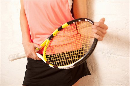 Young woman holding tennis racket Foto de stock - Sin royalties Premium, Código: 649-06812838