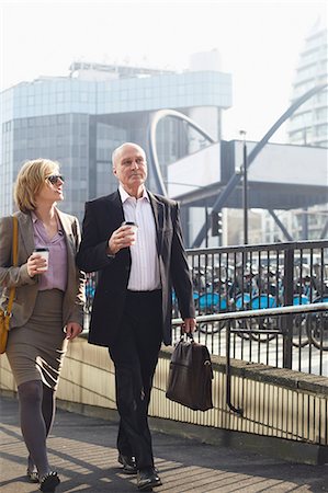 europe sidewalk cafe - Two businesspeople walking in city Photographie de stock - Premium Libres de Droits, Code: 649-06812865