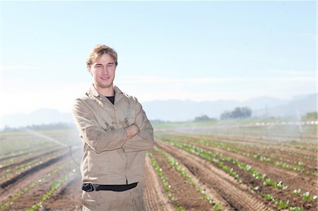 Young man in potato field, portrait Fotografie stock - Premium Royalty-Free, Codice: 649-06844232