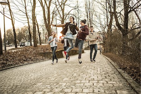 Five teenagers fooling around in park Stock Photo - Premium Royalty-Free, Code: 649-06844591