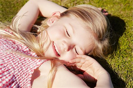 Child lying down on grass Stock Photo - Premium Royalty-Free, Code: 649-06844921