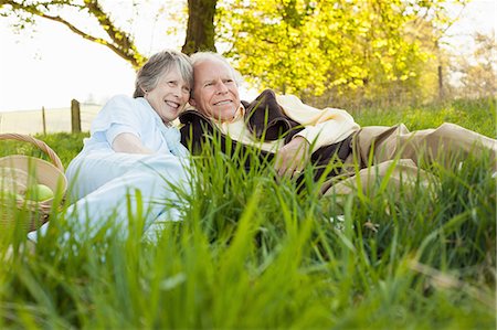 senior couple healthy - Senior couple relaxing and having picnic on field Stock Photo - Premium Royalty-Free, Code: 649-06844951