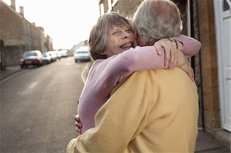 supportive hug - Husband and wife hugging lovingly on street Stock Photo - Premium Royalty-Free, Code: 649-06844965