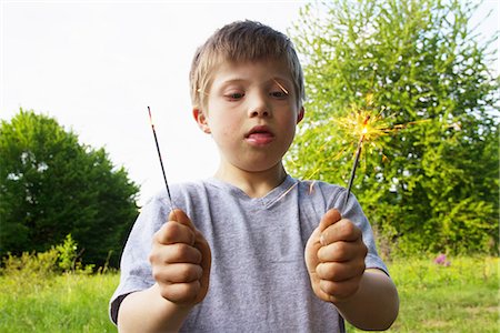 simsearch:649-06845253,k - Portrait of boy holding sparklers Stock Photo - Premium Royalty-Free, Code: 649-06845254