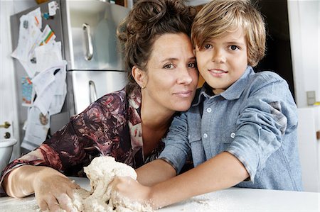 starting position - Mother and son baking in kitchen Stock Photo - Premium Royalty-Free, Code: 649-06943760