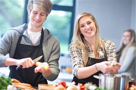 simsearch:649-07064013,k - Young couple preparing food Stock Photo - Premium Royalty-Free, Code: 649-07064026