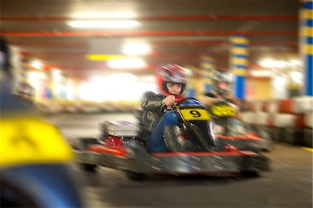 female driver - Young woman racing on go cart track Stock Photo - Premium Royalty-Free, Code: 649-07064099