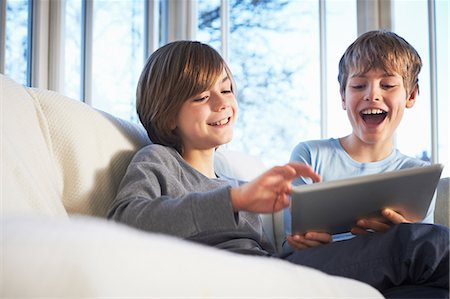 preteen boy - Brothers using digital tablet together Stock Photo - Premium Royalty-Free, Code: 649-07064279