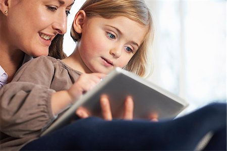 simsearch:649-07064267,k - Mother and daughter using digital tablet Stock Photo - Premium Royalty-Free, Code: 649-07064272