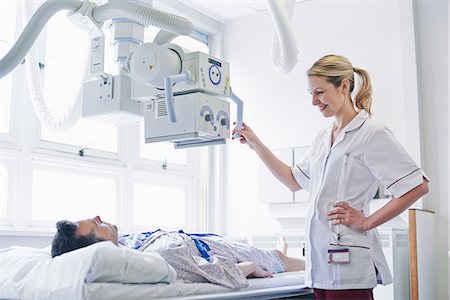 radiology patient - Radiologist scanning patient Stock Photo - Premium Royalty-Free, Code: 649-07064691