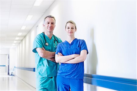 simsearch:649-07064718,k - Surgeon and doctor standing in corridor Stock Photo - Premium Royalty-Free, Code: 649-07064725