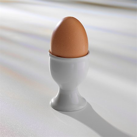 eggs white background - Boiled egg in egg cup Stock Photo - Premium Royalty-Free, Code: 649-07064955