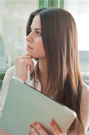 staring at women in office - Young woman in office looking out of window Foto de stock - Sin royalties Premium, Código: 649-07063115